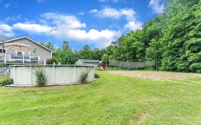 5856 Peck Rd, Brown City, MI 48416 - view of grassy yard with an outdoor pool and volleyball court
