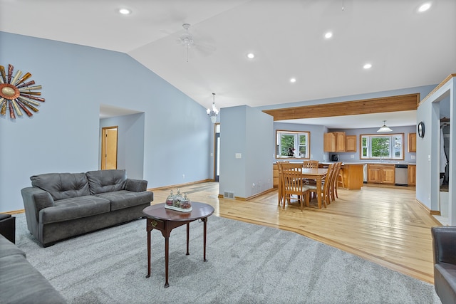 5856 Peck Rd, Brown City, MI 48416 - living room featuring light wood-style floors, lofted ceiling, ceiling fan, recessed lighting, and a chandelier