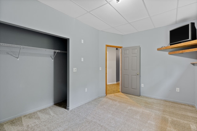 5856 Peck Rd, Brown City, MI 48416 - unfurnished bedroom with a drop ceiling, carpet, baseboards, and a closet