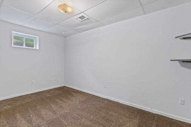 5856 Peck Rd, Brown City, MI 48416 - spare room with a paneled ceiling, carpet floors, and baseboards