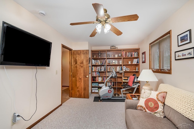 217 Maple Rd, Roscommon, MI 48653 - living area with carpet floors and a ceiling fan