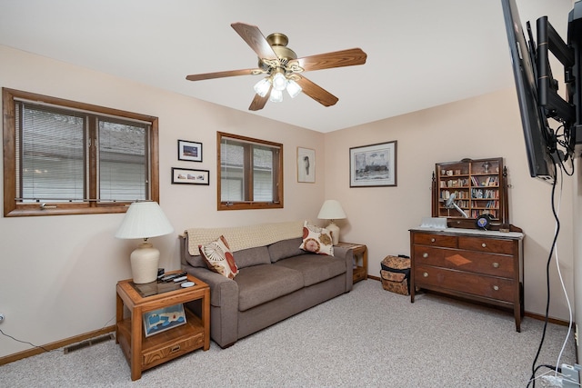 217 Maple Rd, Roscommon, MI 48653 - living area with carpet floors and ceiling fan