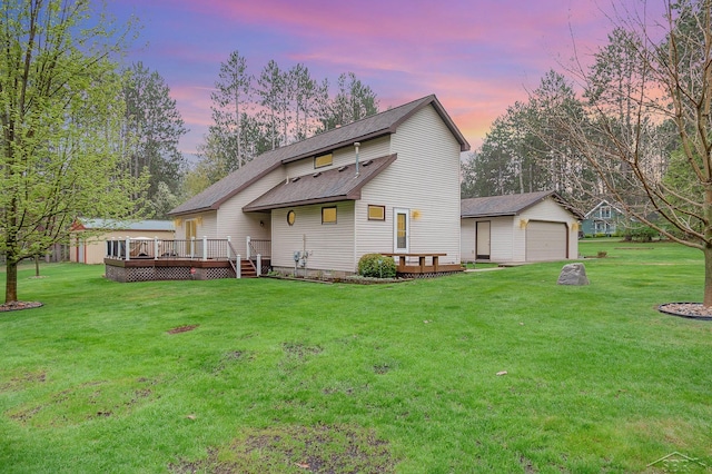 217 Maple Rd, Roscommon, MI 48653 - rear view of property with a deck, an outdoor structure, a shingled roof, and a yard