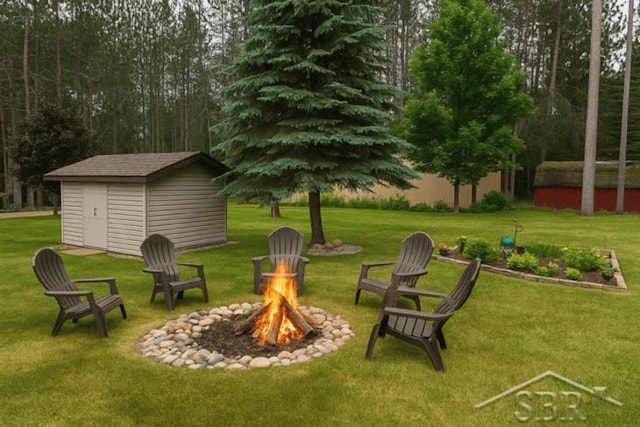 217 Maple Rd, Roscommon, MI 48653 - view of green lawn with an outdoor fire pit and a storage shed