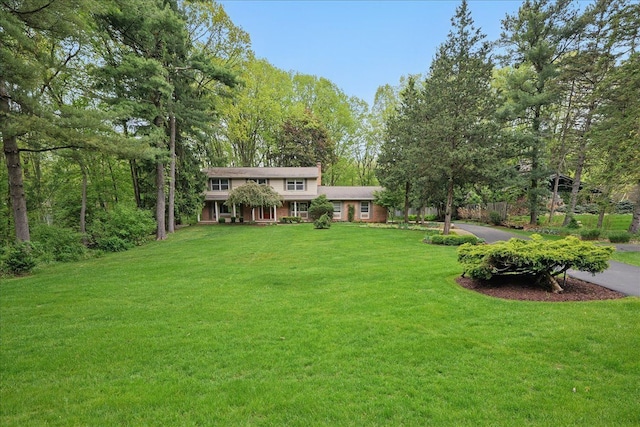 1558 Sylvan Glen Rd, Okemos, MI 48864 - view of front facade featuring a front lawn