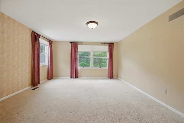1558 Sylvan Glen Rd, Okemos, MI 48864 - carpeted spare room with baseboards