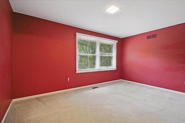 1558 Sylvan Glen Rd, Okemos, MI 48864 - carpeted spare room featuring baseboards