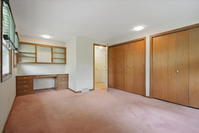1558 Sylvan Glen Rd, Okemos, MI 48864 - unfurnished office featuring built in study area, light carpet, and baseboards