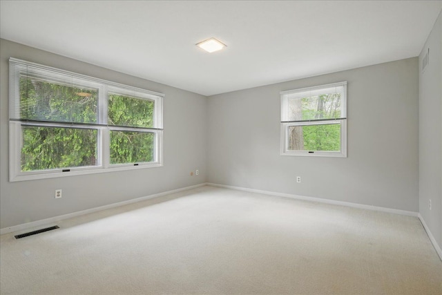 1558 Sylvan Glen Rd, Okemos, MI 48864 - carpeted spare room featuring baseboards