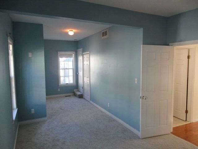 110 N 1st St, Holly, MI 48442 - unfurnished room with baseboards and carpet flooring
