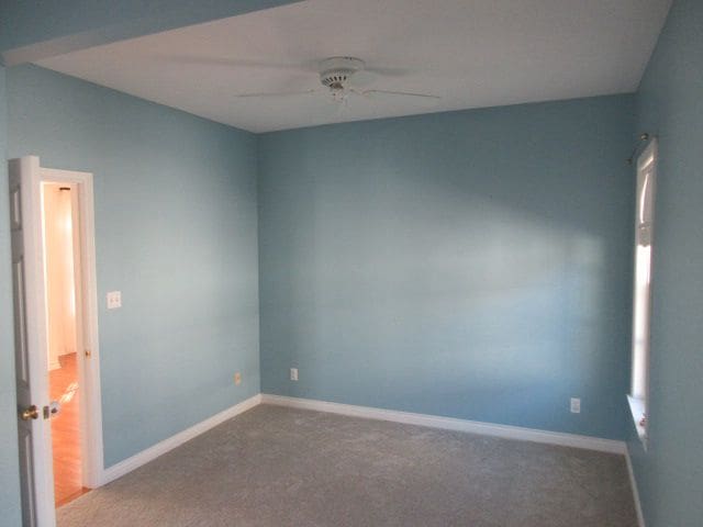 110 N 1st St, Holly, MI 48442 - unfurnished room with ceiling fan, carpet floors, and baseboards