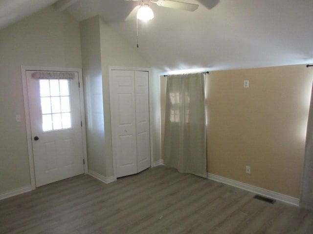 110 N 1st St, Holly, MI 48442 - entrance foyer with wood finished floors, a ceiling fan, and baseboards