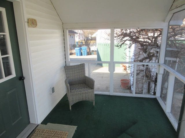 110 N 1st St, Holly, MI 48442 - unfurnished sunroom with lofted ceiling