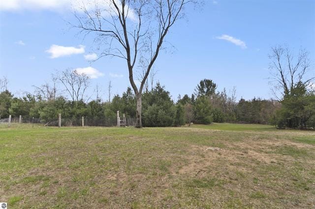 2426 E 48 1/2 Rd, Cadillac, MI 49601 - view of grassy yard with a view of trees
