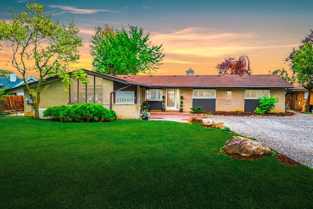 27607 Elba Dr, Grosse Ile, MI 48138 - view of front facade with brick siding and a chimney