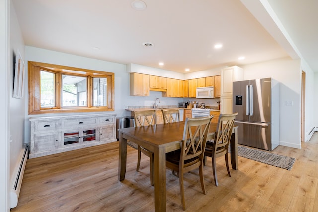 27607 Elba Dr, Grosse Ile, MI 48138 - dining room featuring a baseboard heating unit, light wood-style flooring, recessed lighting, and baseboards
