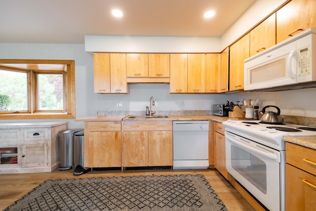 27607 Elba Dr, Grosse Ile, MI 48138 - kitchen with white appliances, a sink, light countertops, light brown cabinetry, and light wood-style flooring