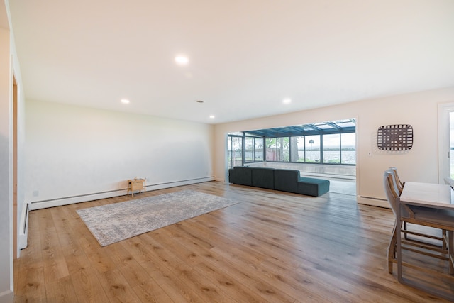 27607 Elba Dr, Grosse Ile, MI 48138 - living room featuring a baseboard heating unit, wood finished floors, and recessed lighting