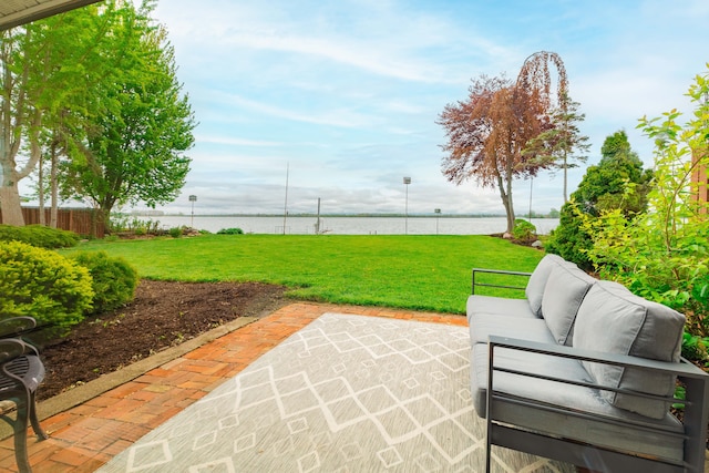 27607 Elba Dr, Grosse Ile, MI 48138 - view of patio with an outdoor living space and a water view