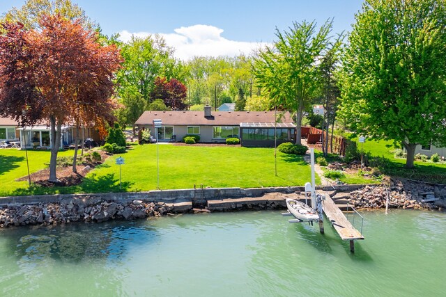 27607 Elba Dr, Grosse Ile, MI 48138 - dock area featuring a yard, a water view, and boat lift
