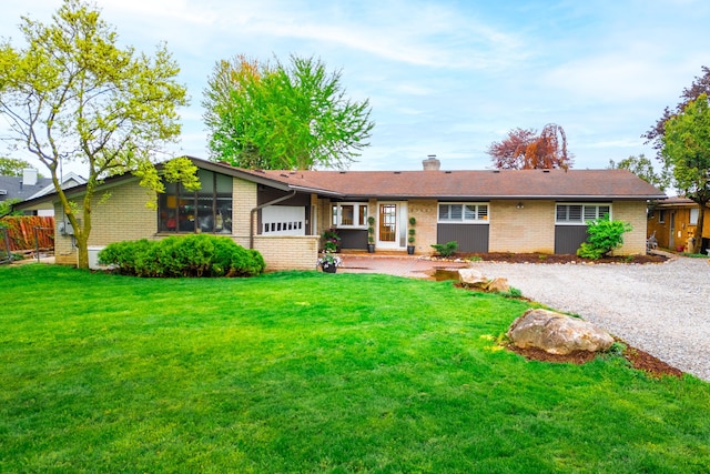 27607 Elba Dr, Grosse Ile, MI 48138 - view of front facade featuring brick siding and a chimney