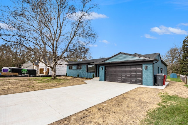 38501 Winkler St, Harrison Township, MI 48045 - ranch-style house with an attached garage, driveway, and brick siding
