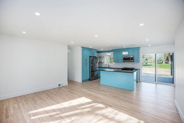 38501 Winkler St, Harrison Township, MI 48045 - kitchen with stainless steel appliances, blue cabinetry, baseboards, decorative backsplash, and light wood-style floors
