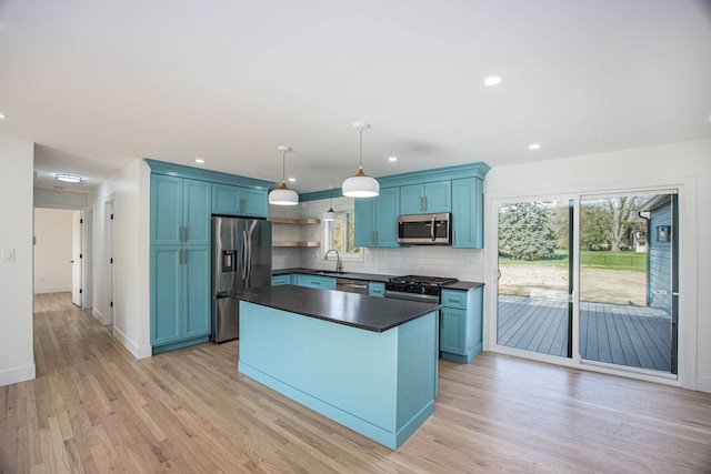 38501 Winkler St, Harrison Township, MI 48045 - kitchen featuring stainless steel appliances, dark countertops, blue cabinets, and recessed lighting