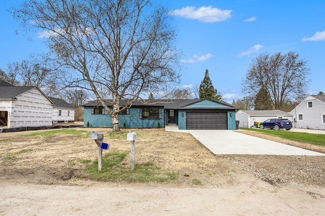 38501 Winkler St, Harrison Township, MI 48045 - ranch-style home with concrete driveway, an attached garage, and a residential view