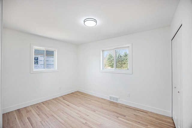 38501 Winkler St, Harrison Township, MI 48045 - unfurnished bedroom with baseboards, light wood-type flooring, and a closet