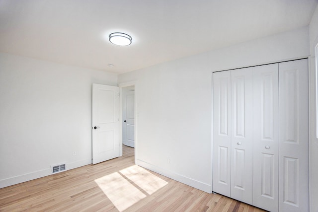 38501 Winkler St, Harrison Township, MI 48045 - unfurnished bedroom featuring light wood-style flooring, baseboards, and a closet