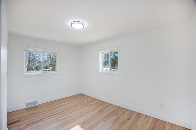 38501 Winkler St, Harrison Township, MI 48045 - unfurnished room with plenty of natural light, baseboards, and light wood-style flooring