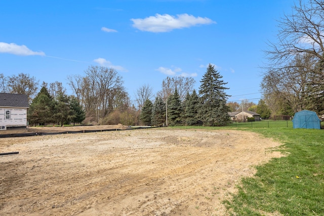 38501 Winkler St, Harrison Township, MI 48045 - view of yard featuring a storage unit, an outdoor structure, and fence