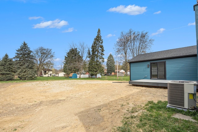 38501 Winkler St, Harrison Township, MI 48045 - view of yard featuring central AC unit, a deck, and fence