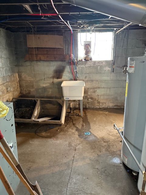 15779 Alden St, Detroit, MI 48238 - basement with gas water heater and a sink