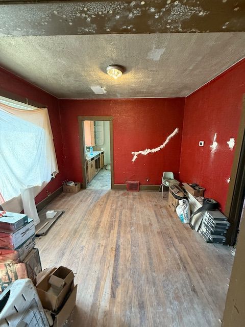 15779 Alden St, Detroit, MI 48238 - unfurnished living room featuring wood finished floors