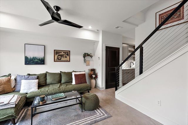 3313 Cochrane St, Detroit, MI 48208 - living area with stairs, concrete flooring, ceiling fan, recessed lighting, and baseboards