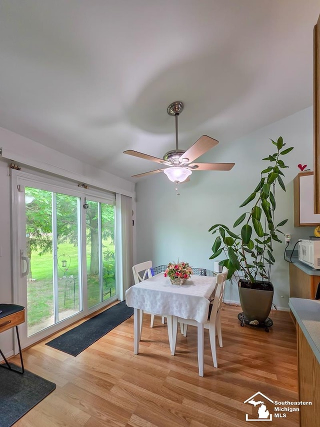 17795 Bobwhite Ct, Brownstown, MI 48192 - dining space with light wood-type flooring and a ceiling fan