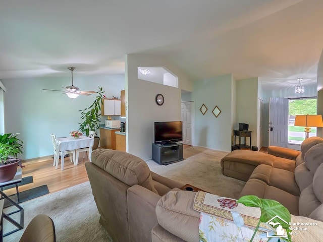 17795 Bobwhite Ct, Brownstown, MI 48192 - living area featuring lofted ceiling, a ceiling fan, and light wood-style floors