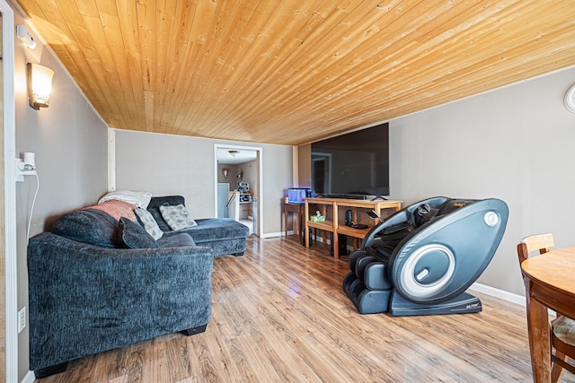 505 S Cherry St, Kalkaska, MI 49646 - living room with wooden ceiling, wood finished floors, and baseboards