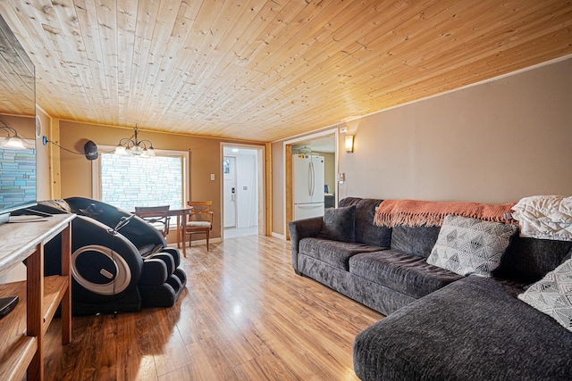505 S Cherry St, Kalkaska, MI 49646 - living room with wood ceiling, wood finished floors, and a chandelier