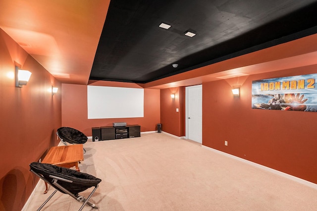 cinema room with carpet and baseboards