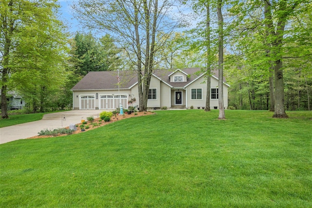 view of front of home with concrete driveway, a front yard, and a garage