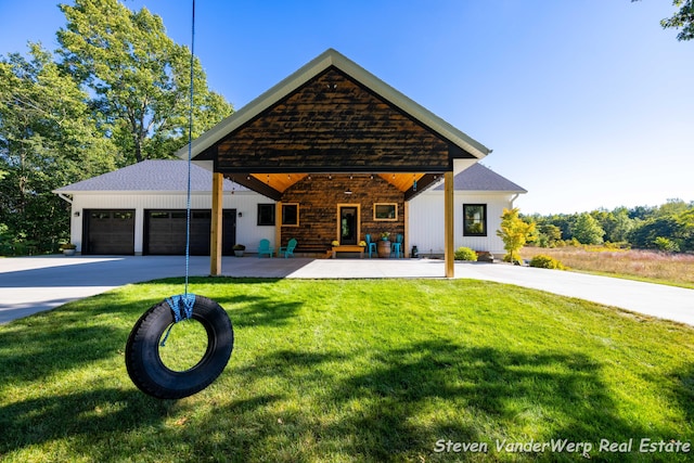 12640 Bucs Dr, Grand Haven, MI 49417 - view of front facade featuring driveway, a front lawn, a garage, and covered porch