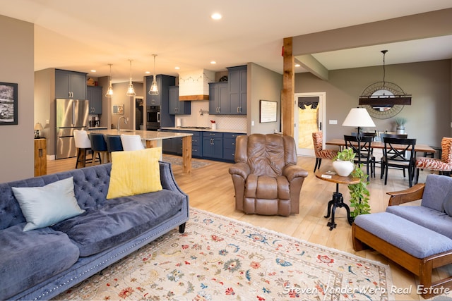 12640 Bucs Dr, Grand Haven, MI 49417 - living area featuring light wood-type flooring and recessed lighting