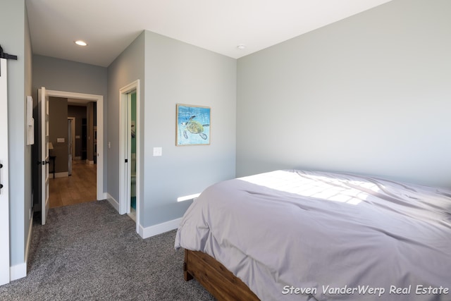 12640 Bucs Dr, Grand Haven, MI 49417 - bedroom with baseboards, dark colored carpet, and recessed lighting
