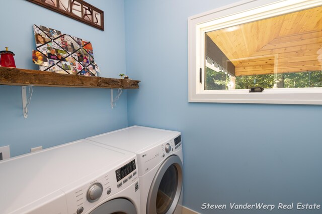 12640 Bucs Dr, Grand Haven, MI 49417 - laundry area with separate washer and dryer and wood ceiling