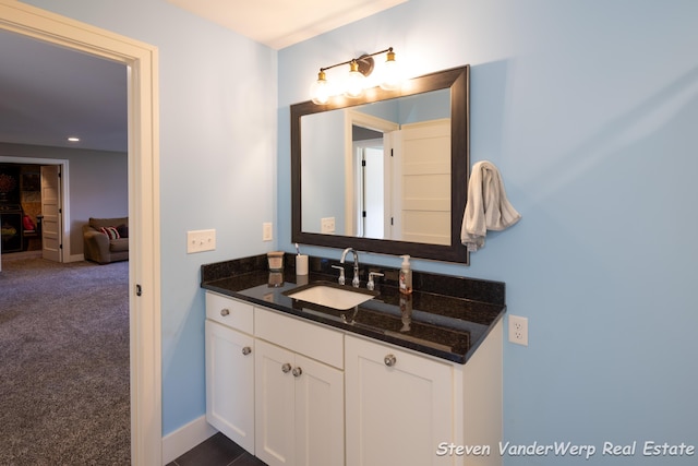 12640 Bucs Dr, Grand Haven, MI 49417 - bathroom with vanity and baseboards