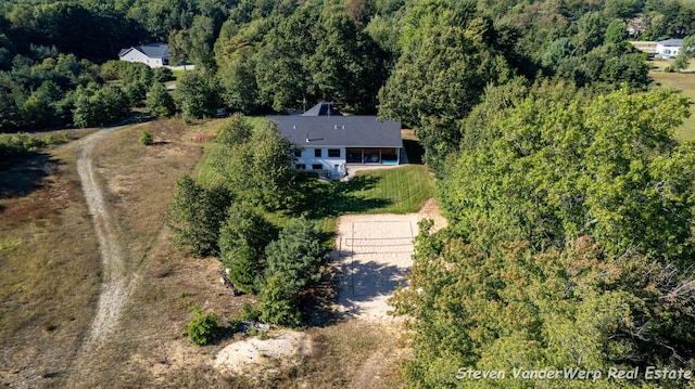 12640 Bucs Dr, Grand Haven, MI 49417 - aerial view of property and surrounding area with a heavily wooded area