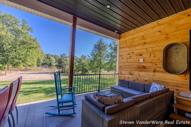 12640 Bucs Dr, Grand Haven, MI 49417 - view of patio with outdoor lounge area and view of scattered trees